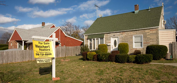 Houses like this one in Levittown, NY are facing foreclosure. The Home Affordable Modification Program seeks to align the interests of borrowers, lenders and investors when foreclosure is not preferable to loan modifications, and helps stabilize housing prices in communities nationwide.<br />
  (AP Photo/Mark Lennihan, file)