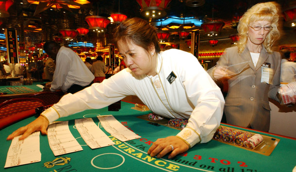 A dealer from one of the Atlantic City casino unions that has been tied up, waiting for a first contract for over two years. (AP/Mary Godleski)