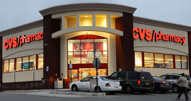 A customer approaches a CVS pharmacy in Saugus, MA, on February 18, 2009. CVS/Caremark is one of the three largest Pharmacy Benefit Managers, which is considered the only segment of the health insurance market that is unregulated by the Federal Trade Commission.  (AP/Lisa Poole)