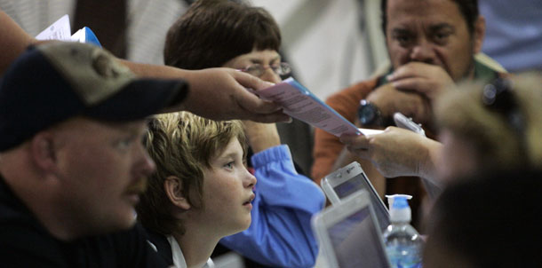 Patients register for health care at the Remote Area Medical Health Clinic at the fairgrounds in Wise, Virginia on July 24, 2009. As Congress and the administration wrestle with the big picture and the very important details, it will be critically important to ensure that health reform guarantees that coverage and care will be affordable for Americans of all incomes. (AP/Steve Helber)