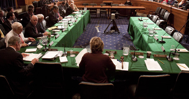 Senate Environment and Public Works Committee Chairwoman Barbara Boxer (D-CA), (back to camera), presides over the committee's vote on the Clean Energy Jobs Act on November 5, 2009. The committee passed the bill by an 11-1 vote. (AP/Harry Hamburg)