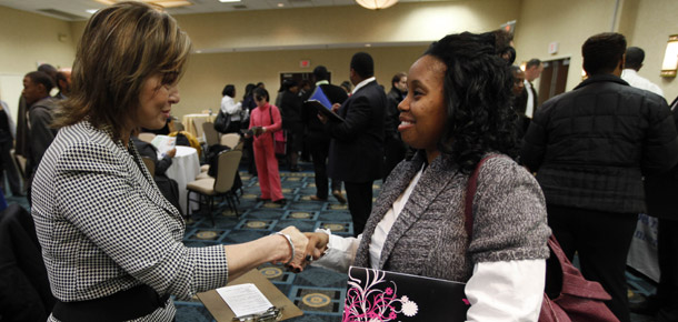 Job seeker Lenore Price, right, of Philadelphia, meets with Rose Paschoaletto with Mary Kay during a job fair in Philadelphia on December 1, 2009. The House passed the Jobs for Main Street Act of 2010 today, which contains several provisions to create jobs for those affected by the recession. (AP/Matt Rourke)