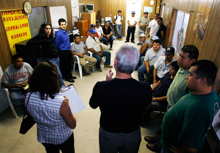 Laborers' International Union President Terence O'Sullivan addresses day laborers at a job center in Los Angeles. (AP/Damian Dovarganes)