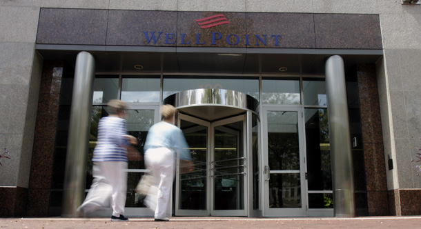 Guests enter WellPoint, Inc. headquarters in a Indianapolis. (AP/Darron Cummings)
