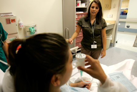 Patient relations coordinator Luisa Wolf talks with a Hispanic-American patient at Hanover Hospital in Hanover, Pennsylvania. (AP/Carolyn Kaster)