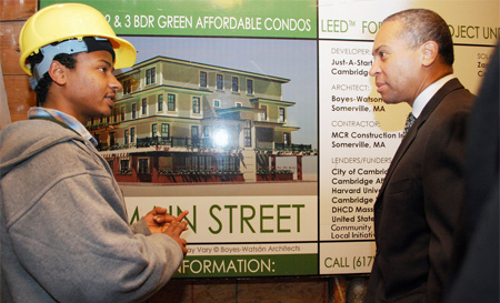 Governor Patrick joins a YouthBuild participant at an event announcing $160,000 in stimulus funding to help connect youth to green jobs training. (Flickr.com/Gov.Patrick)