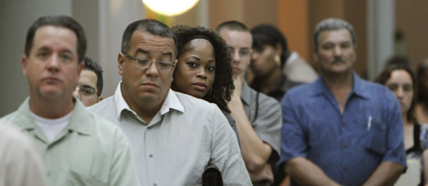 Job seekers wait in line at a National Career Fair in Fort Lauderdale, FL. Congress must invest in job creation this year, which is why the Senate must act swiftly to pass The American Jobs and Closing Tax Loopholes Act upon returning from recess. (AP/J Pat Carter)