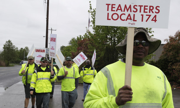 Seattle-area garbage workers represented by Teamsters union Local 174 strike on April 21, 2010. Despite a recent drop in overall approval for unions the public continues to value many of the functions unions perform—such as helping workers. Moreover, support for unions should rise again when the economy improves. (AP/Ted S. Warren)