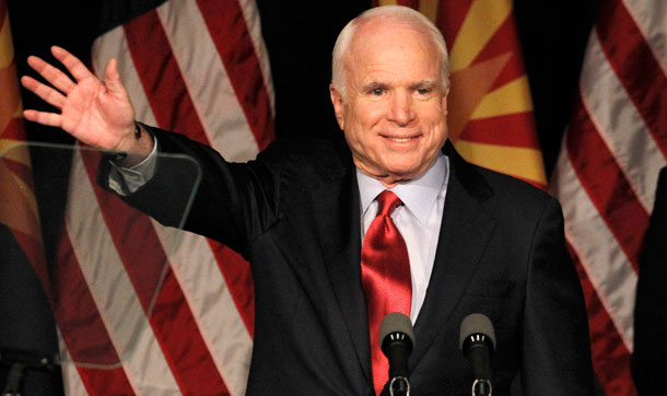 John McCain waves to supporters at an election victory party on August 24, 2010. (AP/Ross D. Franklin)