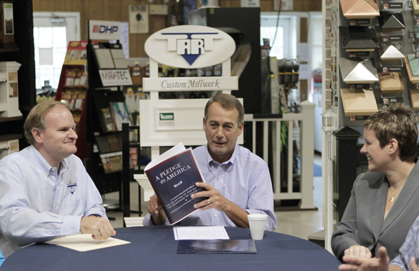 House Minority Leader John Boehner of Ohio, center, accompanied by Craig Fritsche, president of Tart Lumber, left, and Tabetha A. Baume-Chandler, president of Facility Technology, gather at Tart Lumber in Sterling, VA, this past Thursday to announce the Republicans' "Pledge to America" agenda. (AP/J. Scott Applewhite)