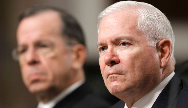 Defense Secretary Robert Gates, right, accompanied by Joint Chiefs Chairman Adm. Michael Mullen, listens to a question on Capitol Hill as they testified before the Senate Armed Services Committee's "Don't Ask, Don't Tell" policy hearing.
  (AP/Alex Brandon)