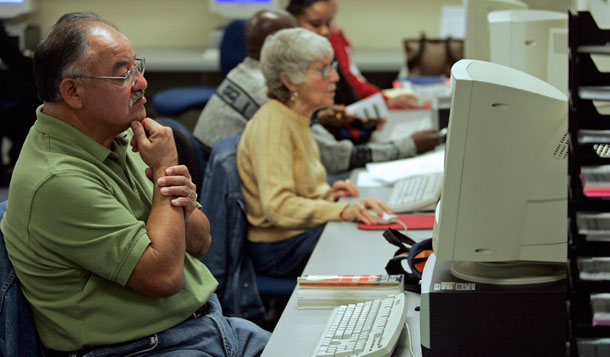 Marco Ignacio Sanchez, an unemployed industrial materials  specialist, looks for a new job at the Marina Del Rey WorkSource Center. In the current job market there are five job seekers for every opening. (AP/Damian Dovarganes)