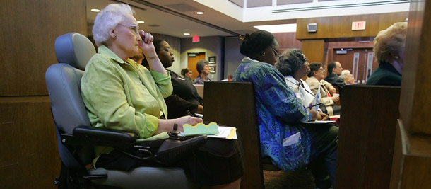 Residents of a retirement home in Hermitage, Tennessee, listen as new Medicare options are explained to them. The GOP budget would replace the guaranteed Medicare benefit with a voucher program. (AP/John Russell)