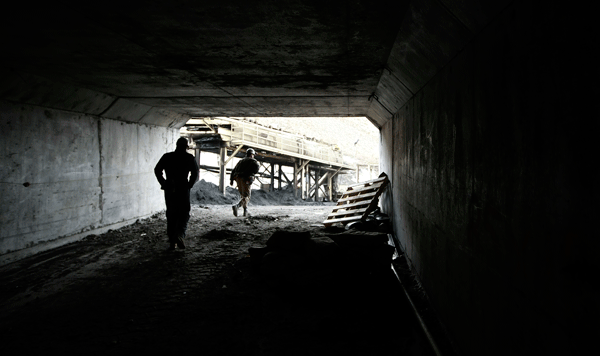 Two miners walk out the entrance of the Horizon Coal Mine outside  Helper, Utah. One of the antiworker riders in the House majority draft  budget bill would prevent the government from reducing black lung among  coal miners. (AP/George Frey)