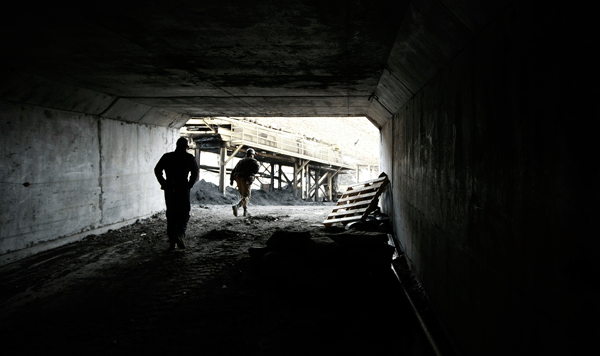 Two miners walk out the entrance of the Horizon Coal Mine outside Helper, Utah. One of the antiworker riders in the House majority draft budget bill would prevent the government from reducing black lung among coal miners. (AP/George Frey)