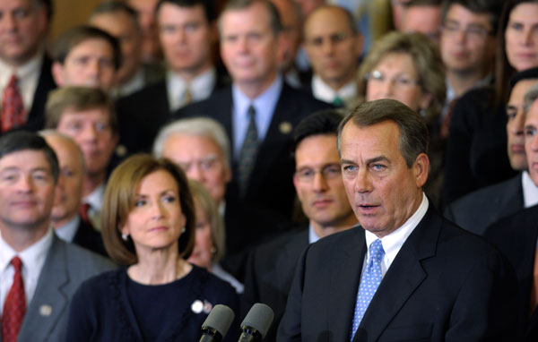 House Speaker John Boehner (R-OH), surrounded by his colleagues, speaks  during a news conference on Capitol Hill in December 2011. The House of Representatives will vote this week on a bill banning any government aid distributed through the Temporary Assistance for Needy Families program from being used at strip clubs, casinos and liquor stores. (AP/Susan Walsh)
