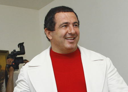 Gagik Tsarukian, leader of the Prosperous Armenia Party, casts his ballot during parliamentary elections in  Yerevan, Armenia, on Sunday, May 6, 2012. (AP/Varo Rafaelyan)