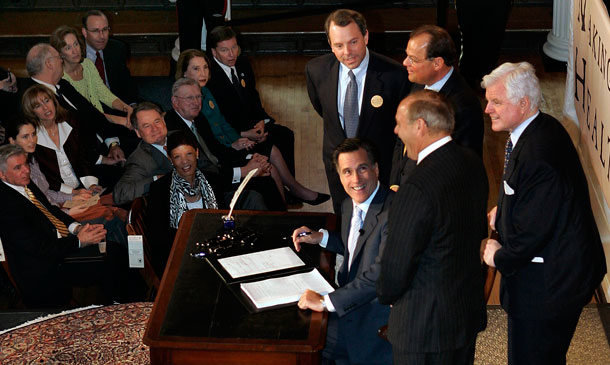 Massachusetts Gov. Mitt Romney reacts at Faneuil Hall in Boston after signing into law his landmark health care bill, designed to guarantee health insurance to virtually all Massachusetts residents. The law provided a blueprint for President Barack Obama's health care law, which Romney has vowed to dismantle.