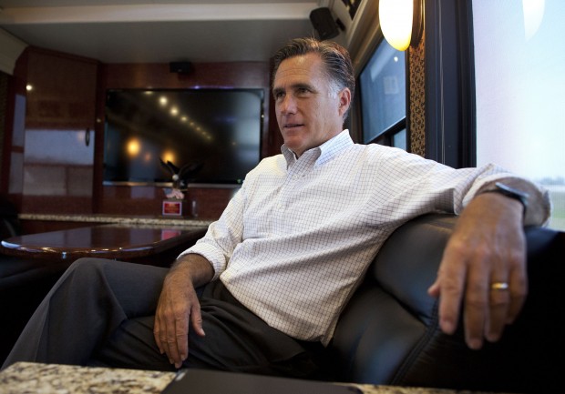 Republican presidential candidate and former Massachusetts Gov. Mitt Romney talks with his staff while riding on his bus after a campaign stop in Council Bluffs, Iowa. (AP/Evan Vucci)