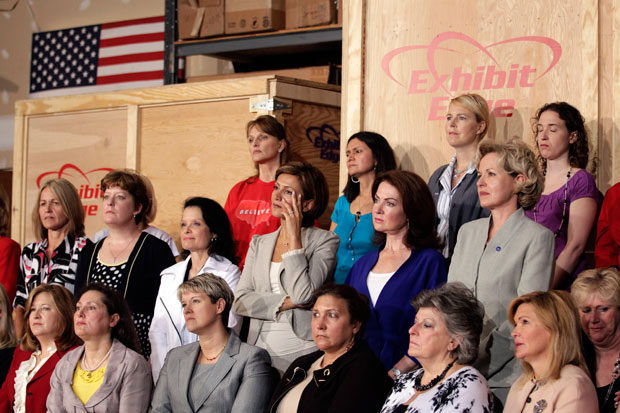 Women listen as Republican presidential candidate, former Massachusetts Gov. Mitt Romney speaks at a campaign stop in Chantilly, Virginiaa. (Women listening to Mitt Romney speech)