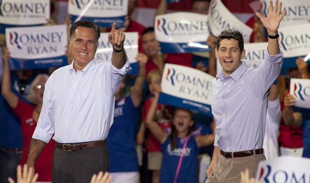 Republican presidential candidate Mitt Romney, left, and his vice-presidential running mate Rep. Paul Ryan (R-WI) arrive at a campaign rally Sunday, August 12, 2012, in Mooresville, North Carolina at the NASCAR Technical Institute. (AP/Jason E. Miczek)