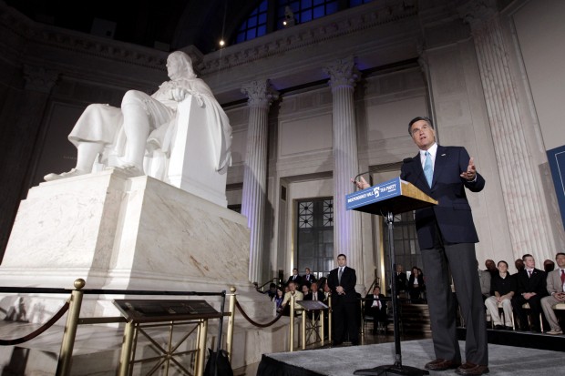 Gov. Mitt Romney, right, stands next to the Benjamin Franklin National Memorial as he speaks at a Tax Day Tea Summit held at the Franklin Institute in Philadelphia (AP/ Jae C. Hong)
