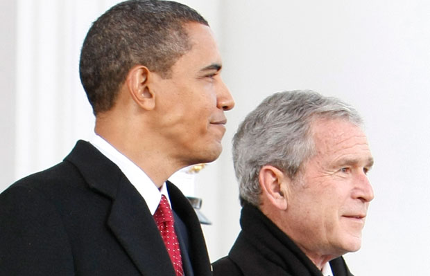 Former President George W. Bush, right, walks out with then-President-elect Barack Obama, left, on the North Portico of the White House before sharing the presidential limousine en route to Capitol Hill for the presidential inauguration in Washington, Tuesday, January 20, 2009. (AP/Pablo Martinez Monsivais)