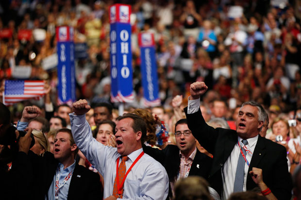 Delegates react as Republican presidential nominee Mitt Romney addresses the crowd at the Republican National Convention. (AP/ Jae C. Hong)