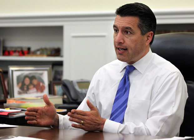 Nevada Gov. Brian Sandoval, along with Utah Gov. Gary Herbert, have backtracked on their recent requests to the Obama administration for some leeway to make TANF more effective and efficient at combatting poverty. (AP/ Cathleen Allison)