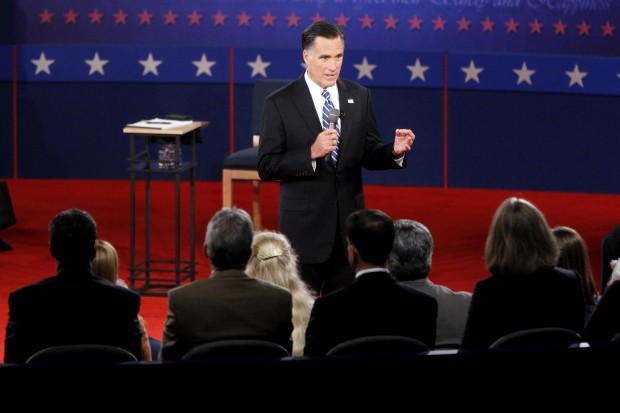 At the second presidential debate, Gov. Mitt Romney continued to avoid giving details of how he would pay for his tax plan, which a new analysis shows would give enormous tax cuts to the wealthiest Americans. (AP/ Mary Altaffer)