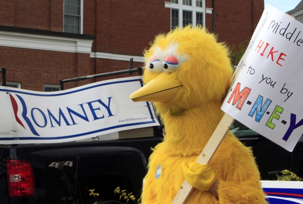 A person dressed as Big Bird holds a sign outside Republican presidential candidate, former Massachusetts Gov. Mitt Romney's headquarters in Derry, New Hampshire (AP/ Jim Cole)