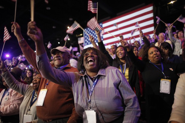 Supporters of President Barack Obama react to favorable media projections at the McCormick Place during an election night watch party in Chicago on election night. (AP/ Jerome Delay)