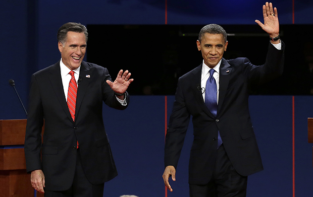 Republican presidential candidate Mitt Romney and President Barack Obama wave to the audience during the first presidential debate at the University of Denver in Denver, Wednesday, October 3, 2012. (AP/Charlie Neibergall)