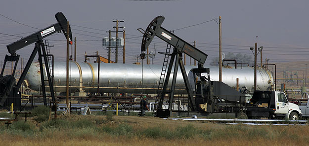 Oil well pump jacks of Chevron Corp. are shown in the hills in Coalinga, California. (AP/Gary Kazanjian)