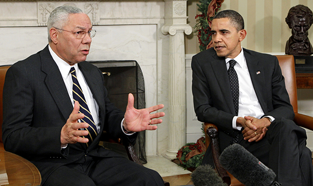 Former Secretary of State Colin Powell meets with President Barack Obama, in the Oval Office at the White House in Washington. Powell, a longtime Republican said on the 