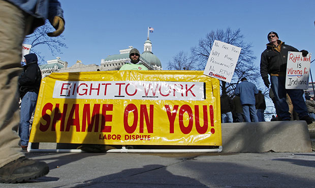 Ben Fairchild of Decatur, Indiana, displays a sign outside of the Statehouse in Indianapolis on January 4, 2012. (AP/Darron Cummings)