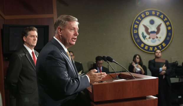 Sen. Lindsey Graham (R-SC), left, accompanied by Sen. Jim DeMint (R-SC), gestures during a news conference on Capitol Hill in Washington, Wednesday, September 14, 2011, to charge that the National Labor Relations Board is playing politics and hindering job growth because of its action against Seattle-based Boeing. (AP/J. Scott Applewhite)