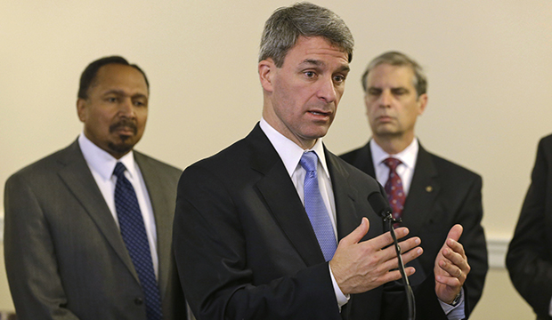 Republican gubernatorial candidate and Virginia Attorney General Ken Cuccinelli, center, gestures during a press conference at the Capitol in Richmond, Virginia, Tuesday, October 15, 2013. (AP/Steve Helber)