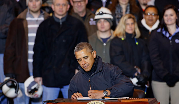 President Barack Obama signed an executive order mandating that federal contractors be required to raise the minimum wage in January 2014. (AP/Gene J. Puskar)