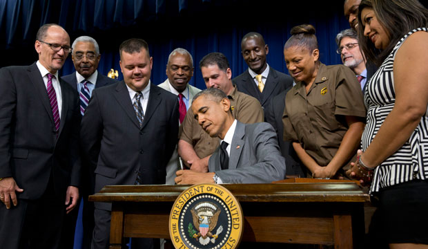 President Barack Obama signs the “Fair Pay and Safe Workplace” executive order, July 2014. (AP/Jacquelyn Martin)