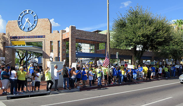 Members of a local union rally for better wages and safety issues outside a transit center in Tucson, Arizona, August 21, 2015. (AP/Astrid Galvan)