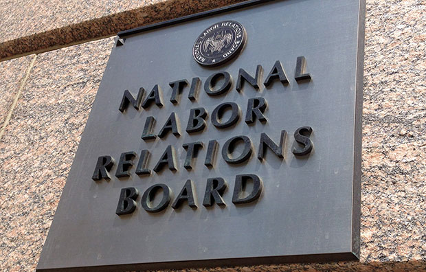 The sign for the National Labor Relations Board is seen on the building that houses its headquarters in downtown Washington, July 17, 2013. (AP/Jon Elswick)