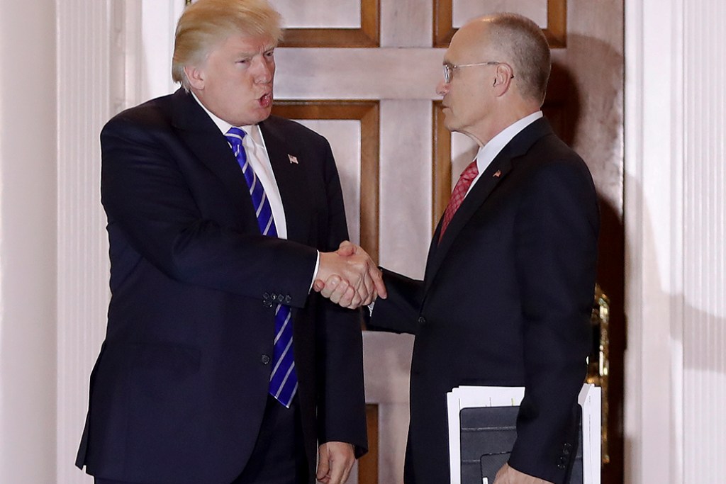 Then-President-elect Donald Trump and Andrew Puzder, CEO of CKE Restaurants, shake hands as Puzder leaves Trump National Golf Club Bedminster Clubhouse in Bedminster, New Jersey, November 19, 2016.