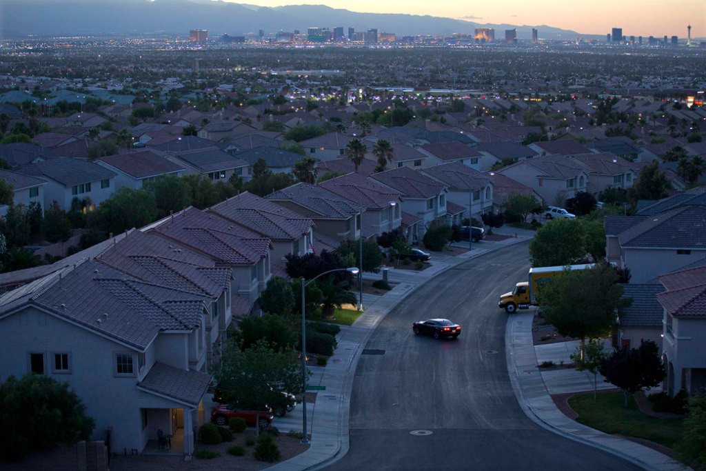 A motorist pulls into a driveway in a Henderson, Nevada, neighborhood on May 29, 2013. (AP/Julie Jacobson)