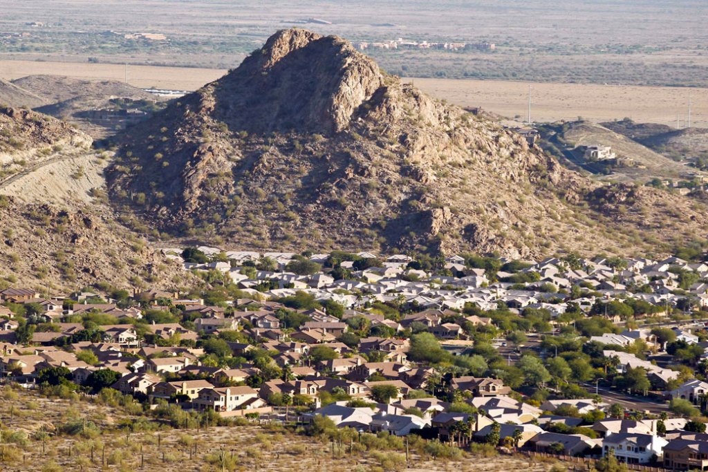 A housing development sits nestled into the South Mountain foothills in Phoenix on December 4, 2012. (AP/Ross D. Franklin)