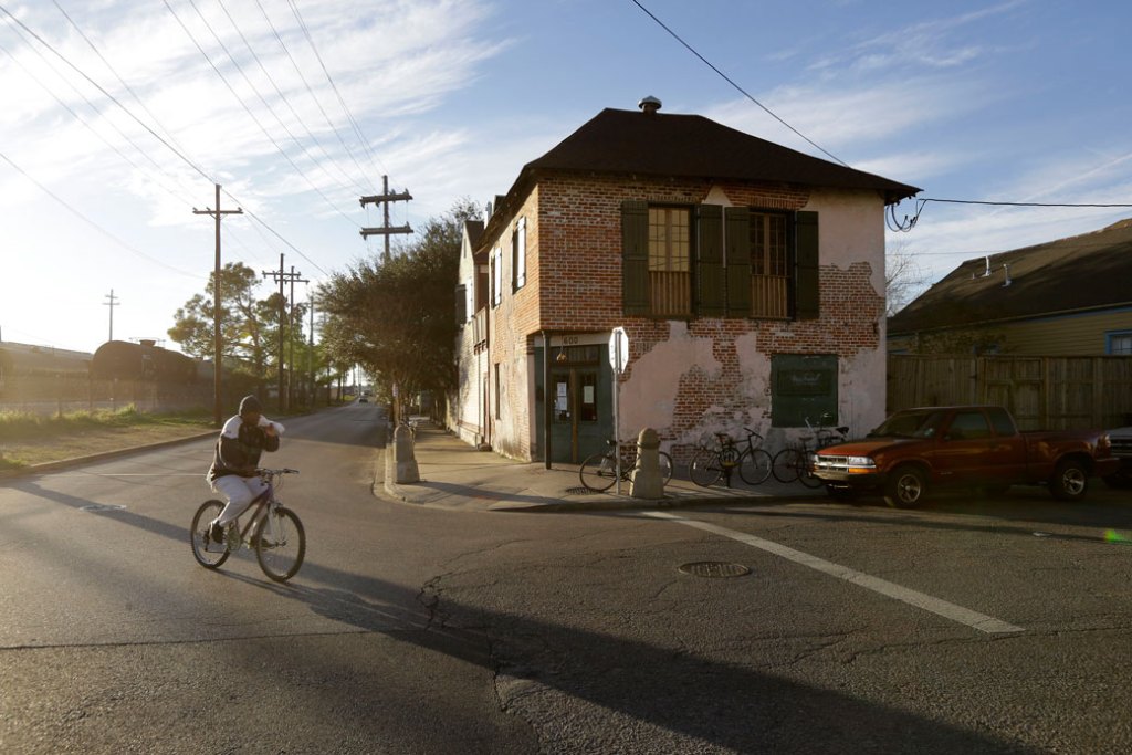 A cyclist turns onto Poland Ave. alongside the Mississippi riverfront in New Orleans on February 13, 2015. (AP/Gerald Herbert)