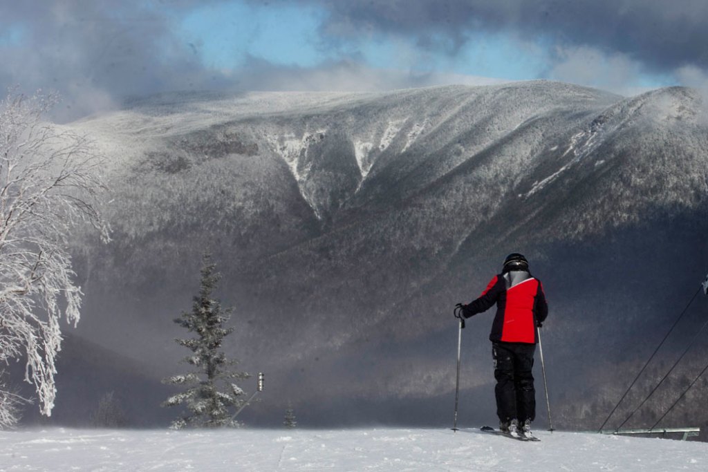 A skier looks out over the White Mountains on November 23, 2016, in Lincoln, New Hampshire. (AP/Jim Cole)