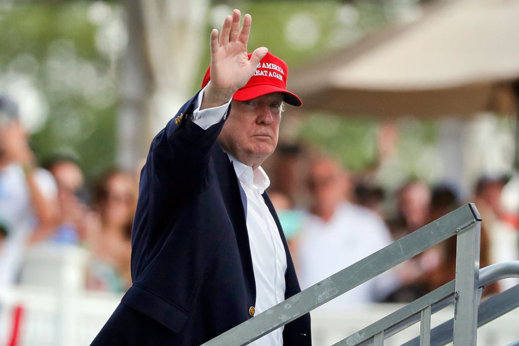 President Donald Trump waves to spectators at the Trump National Golf Club in Bedminster, New Jersey, on July 15, 2017. (AP/Julie Jacobson)