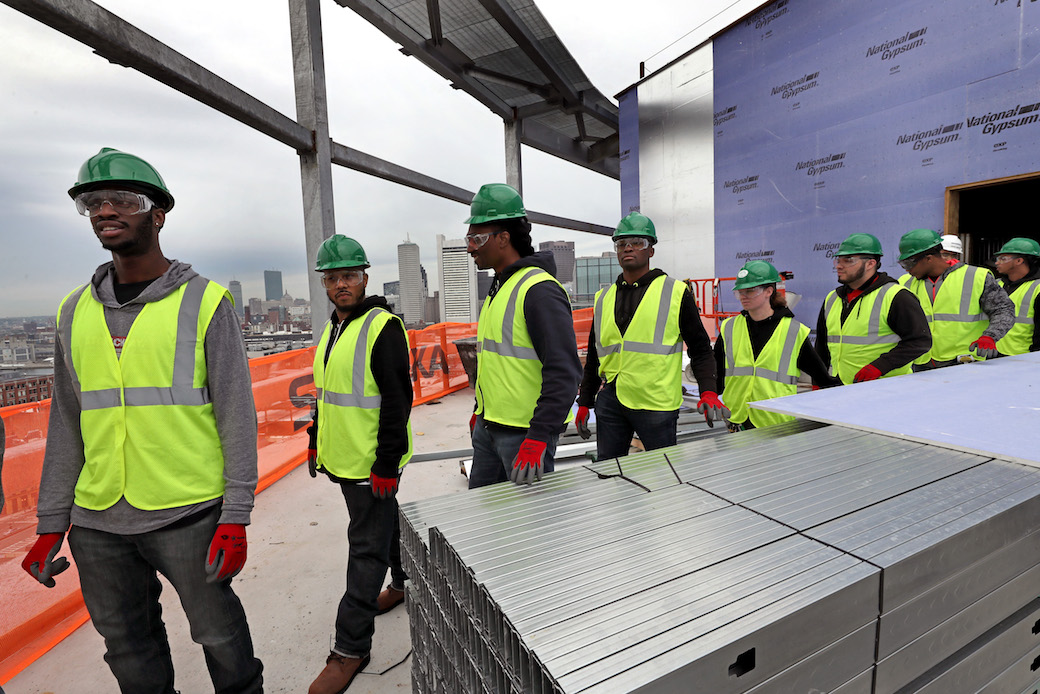 BOSTON, MA - MAY 24: Building Pathways, an organization that creates opportunities for low-income area residents to access and prepare for building trades in the construction industry, tours Skanskas 121 Seaport construction site in Boston on May 24, 2017. The program is 6 weeks and many of them will graduate and pursue union jobs. The day's class had about 10 students ages 19 57. (Photo by David L. Ryan/The Boston Globe via Getty Images) (Getty Images)