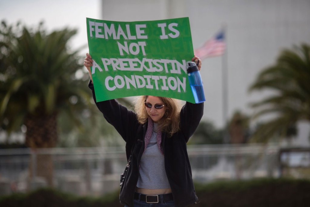 A woman in Los Angeles protests Trump administration policies that threaten the Affordable Care Act, Medicare, and Medicaid, January 25, 2017. (Getty/AFP/David McNew)